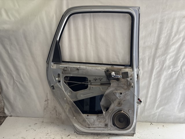 13646 Opel Meriva A 2003-2010 Bal hátsó Ajtó Használt Szürke z157  a képen látható sérüléssel