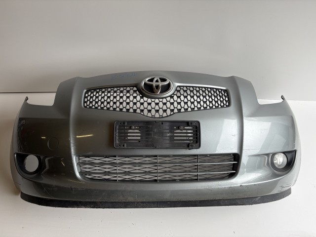 16358 Toyota Yaris II. első Lökhárító Szürke