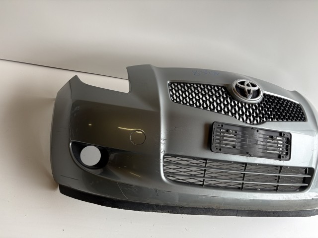 16358 Toyota Yaris II. első Lökhárító Szürke